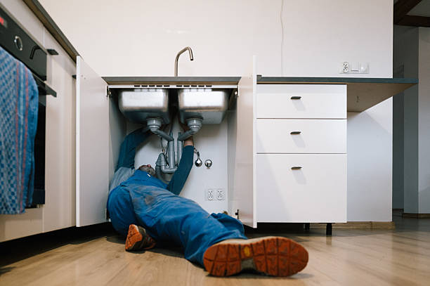 Professional Emergency Plumber technician working in Thayer, IL